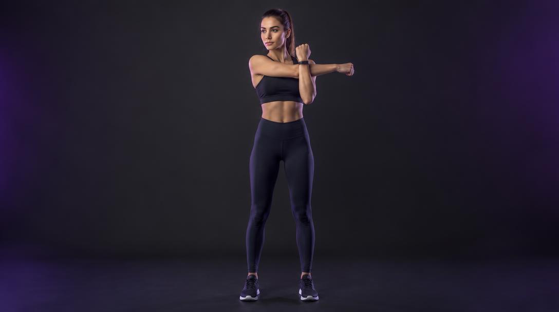 Cross-Body Arm Sweep: Woman pulling one arm across her chest with the opposite forearm