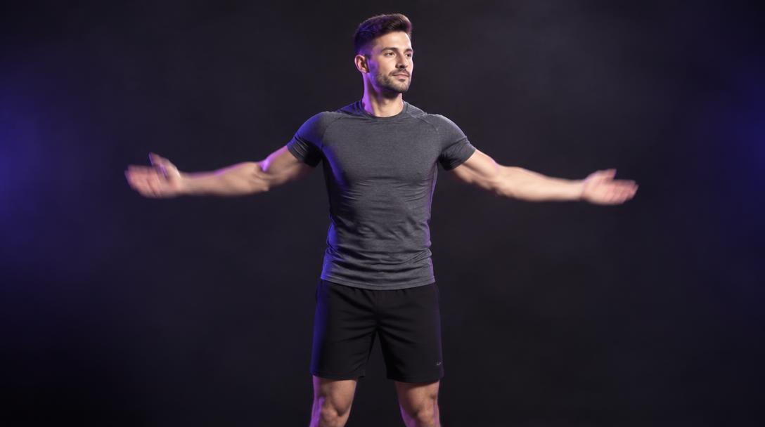 Supinated Arm Swings: Man swinging both arms open with palms turned up